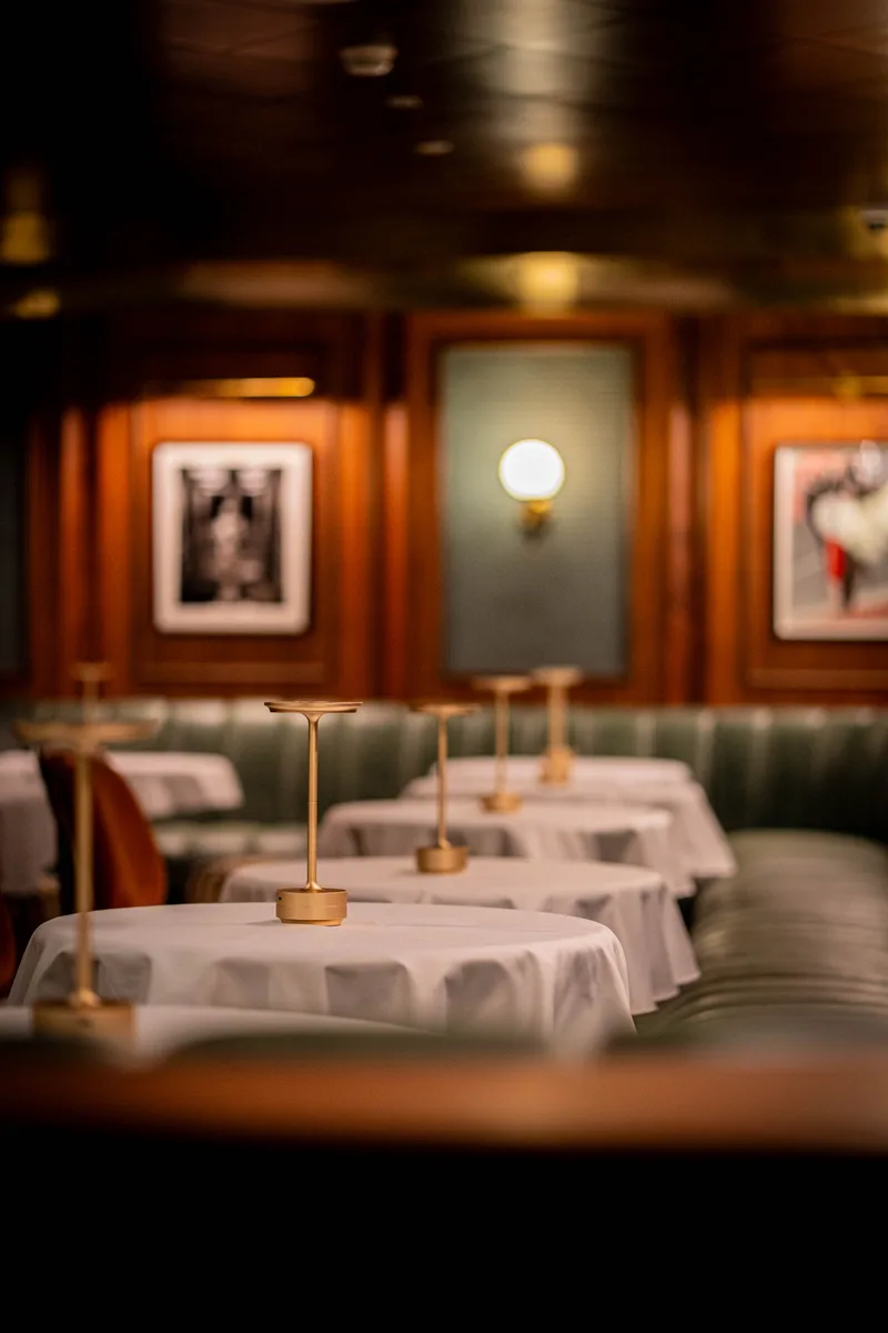 Brass table lamp in a softly lit dining room